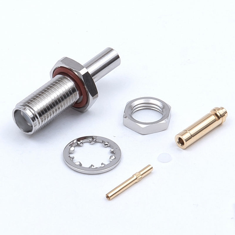 Tyclon bulkhead jack coaxial connector shown with its nut and washer, designed for secure mounting directly through a housing panel or chassis wall.