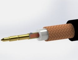 Close-up showing a male center contact pin securely soldered onto the central core wire of a coaxial cable.